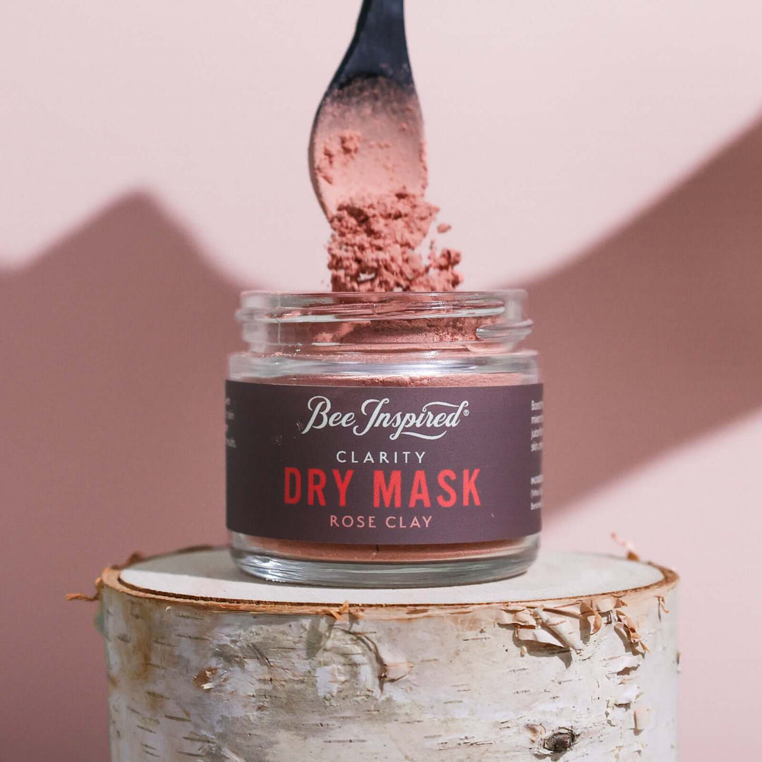 spooning Clarity dry mask out of the petite jar
