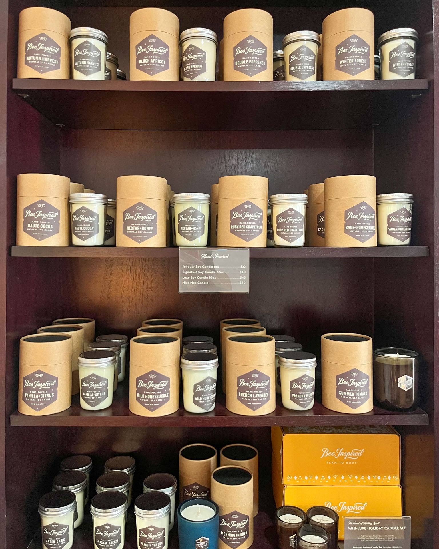 soy candles on shelves at bee inspired goods ellicott city retail store