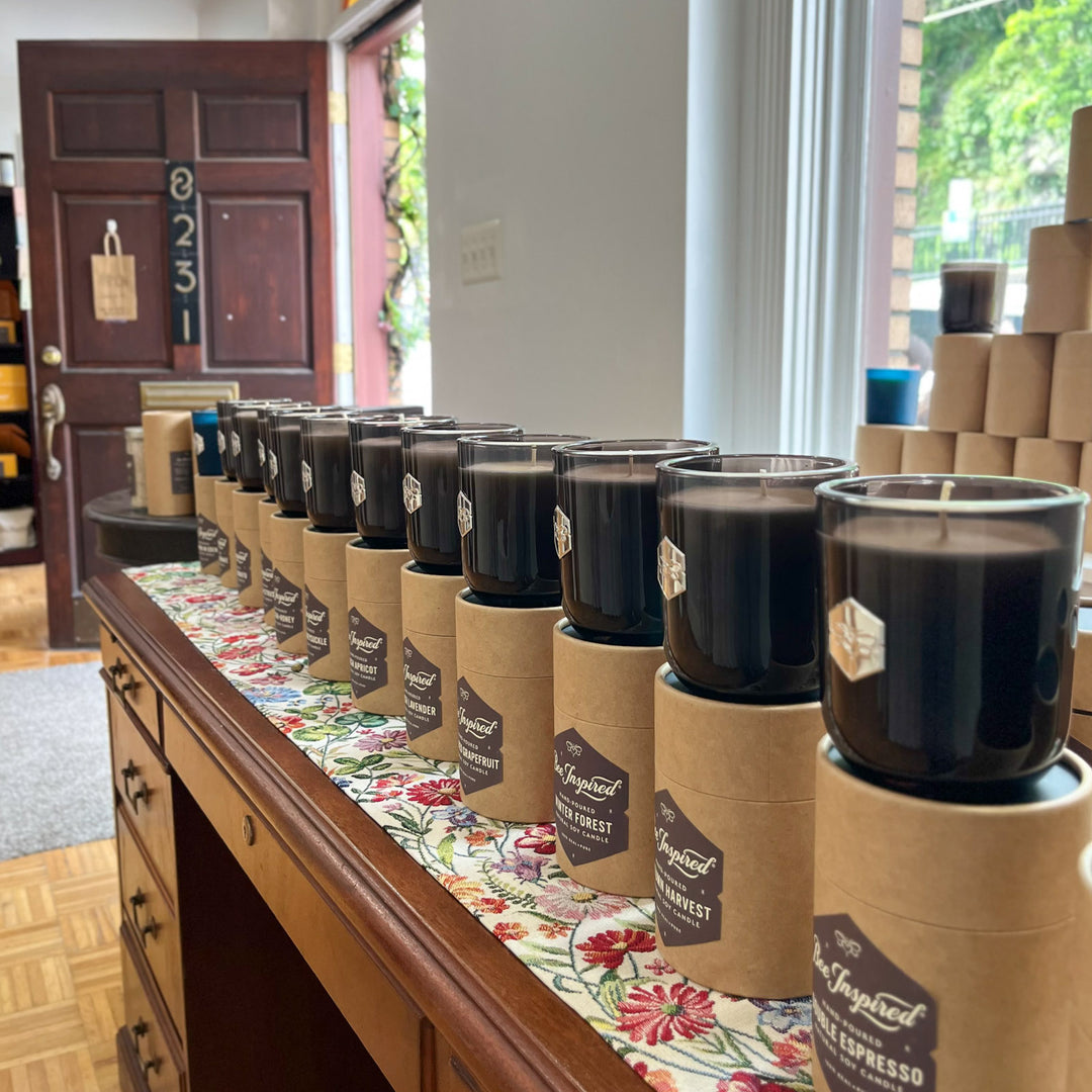 luxe soy candles lined up inside bee inspired goods ellicott city store