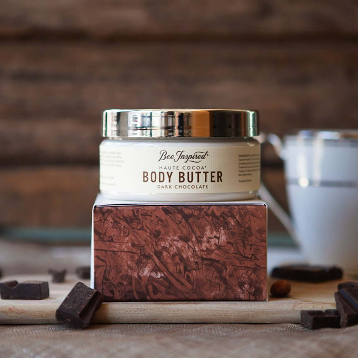 haute coca body butter from bee inspired honey retail store in owings mills on its box on a cutting board with chocolate pieces