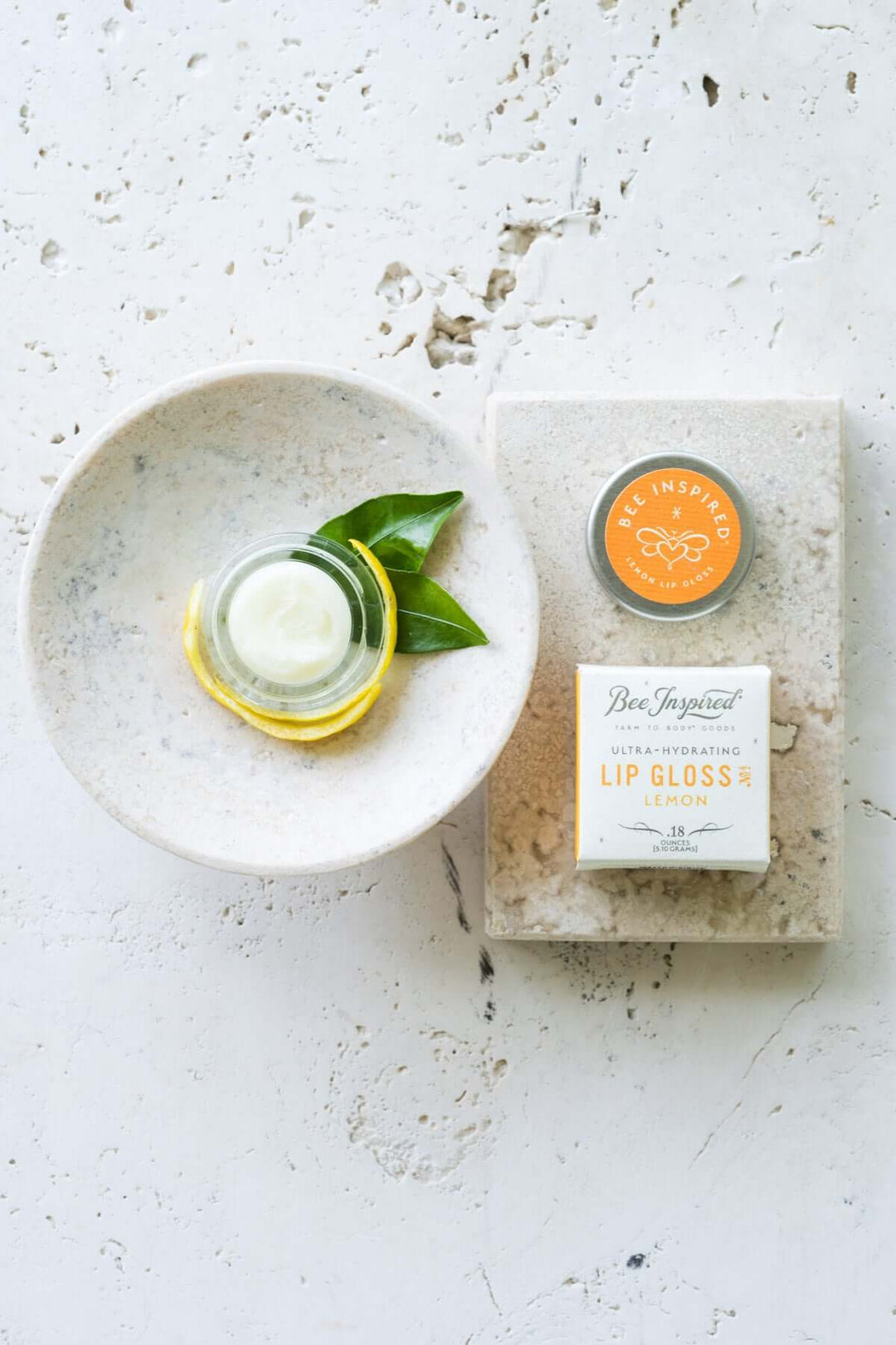 Lemon lip gloss on soap tray