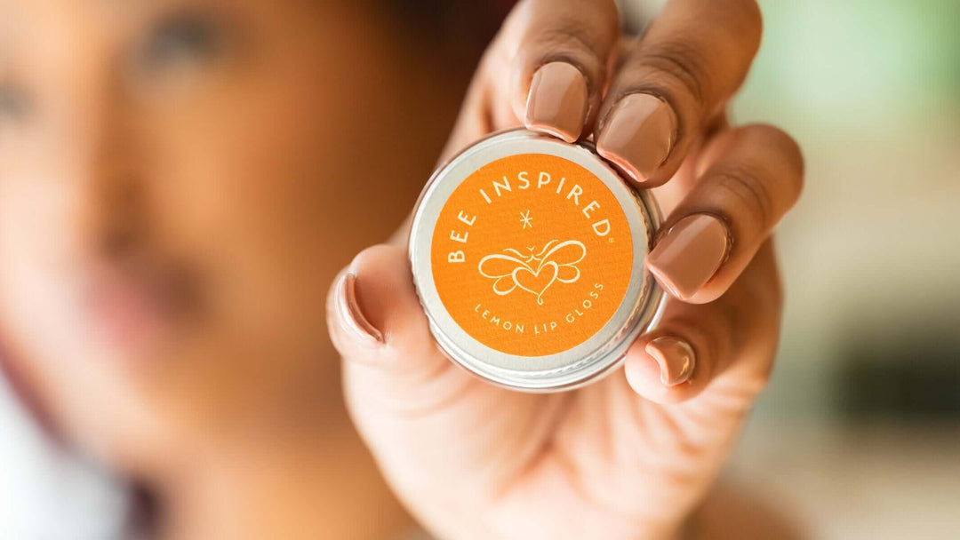 Person holding lemon lip gloss