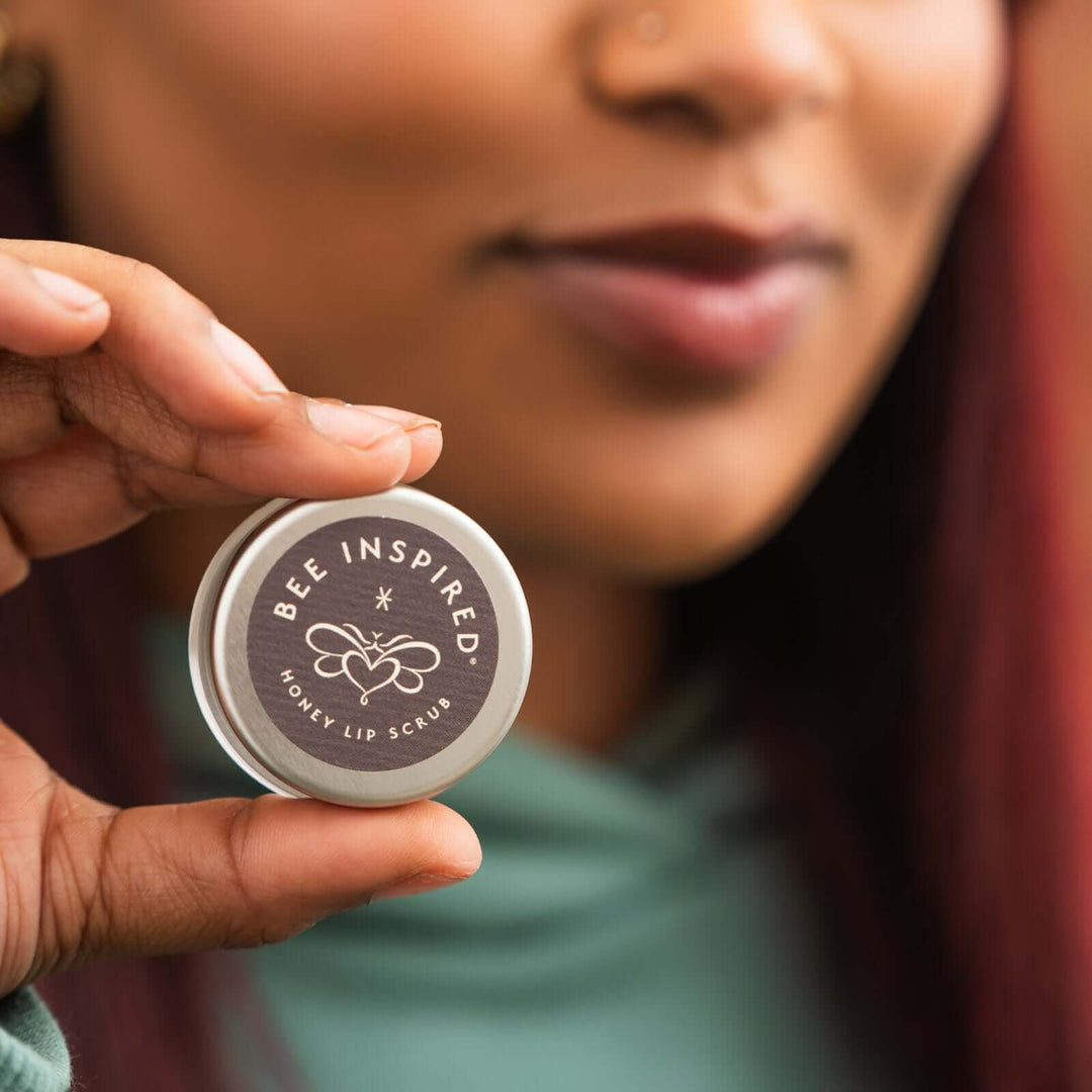 Woman holding honey lip scrub