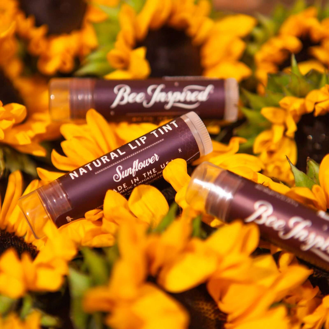 Sunflower lip tints on sunflowers