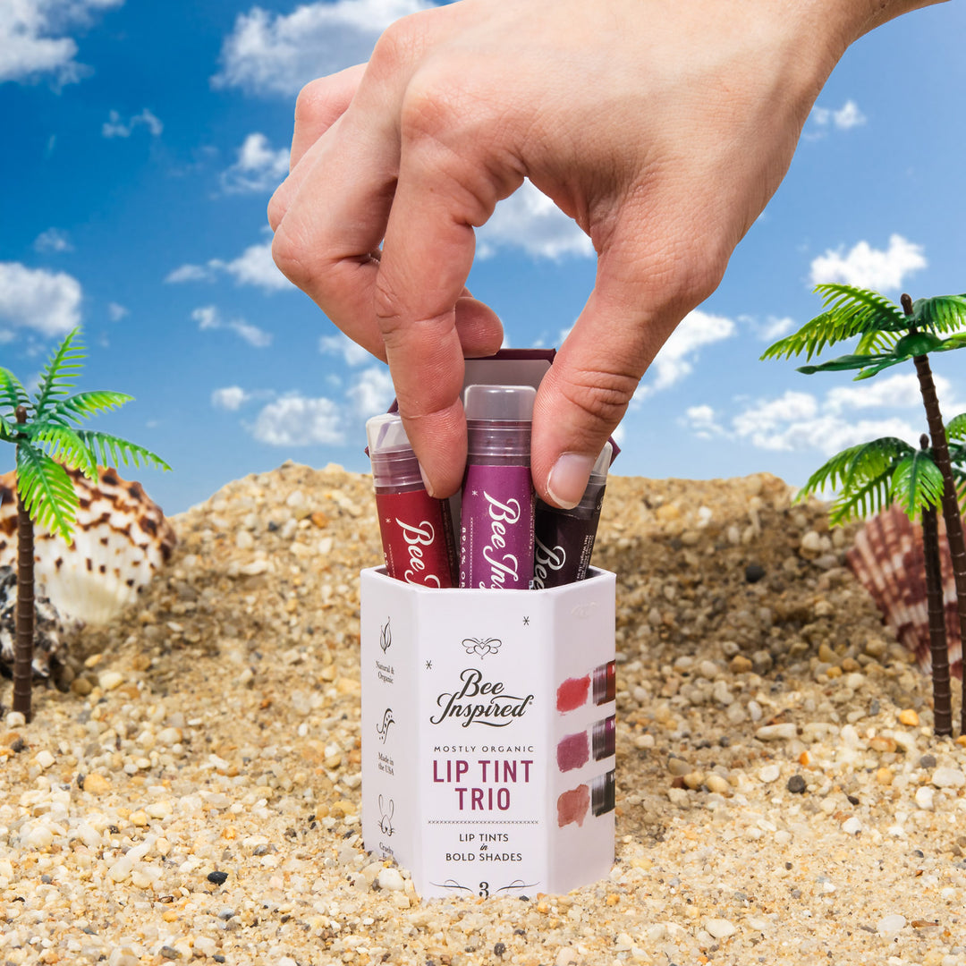 lip tint trio in bold shades on the beach