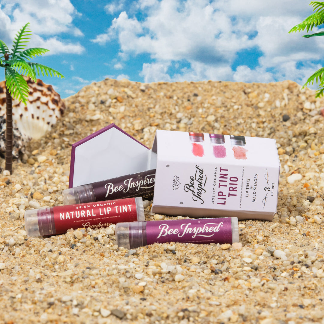 lip tint trio in bold shades spilled on the beach