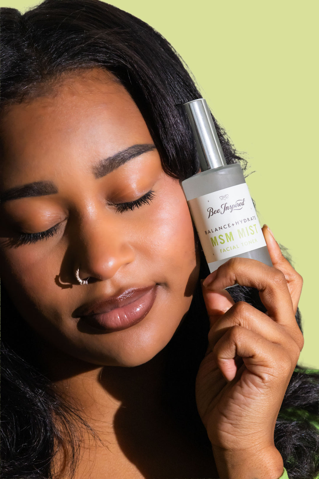 holding MSM Mist bottle