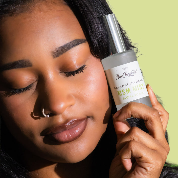 holding MSM Mist bottle