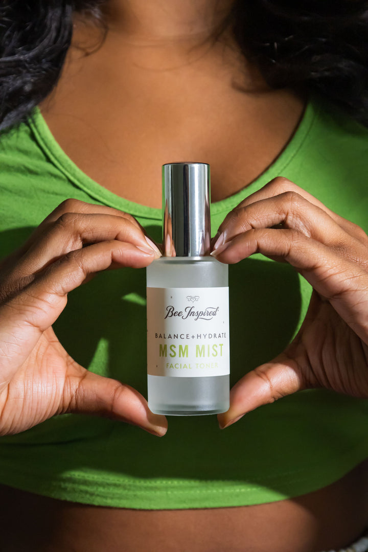 holding MSM Mist bottle between heart-hands