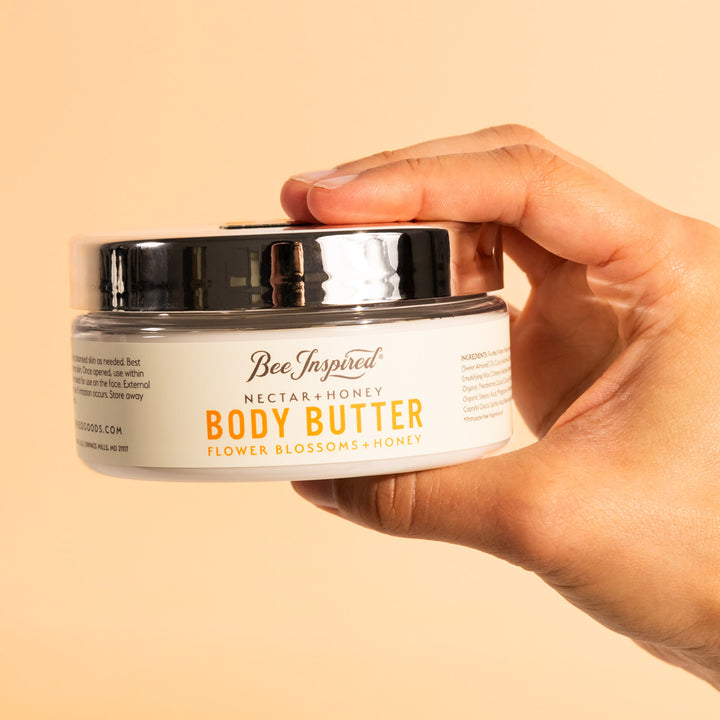 hand holding nectar and honey body butter
