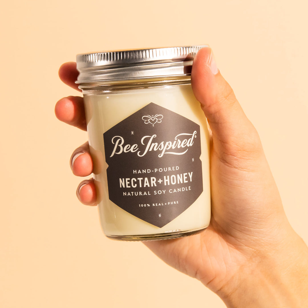 hand holding nectar and honey soy candle