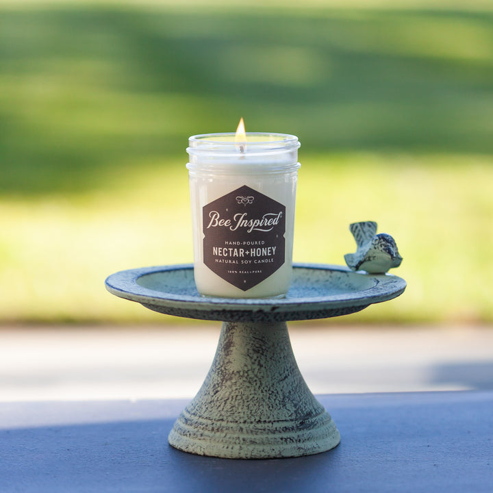 nectar and honey soy candle on a bird bath