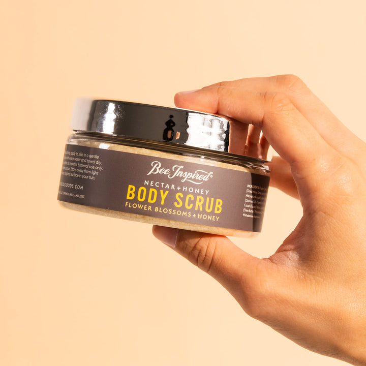 hand holding nectar and honey body scrub