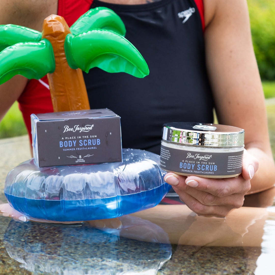 Place in the Sun body scrub on a mini palm tree inflatable in the pool