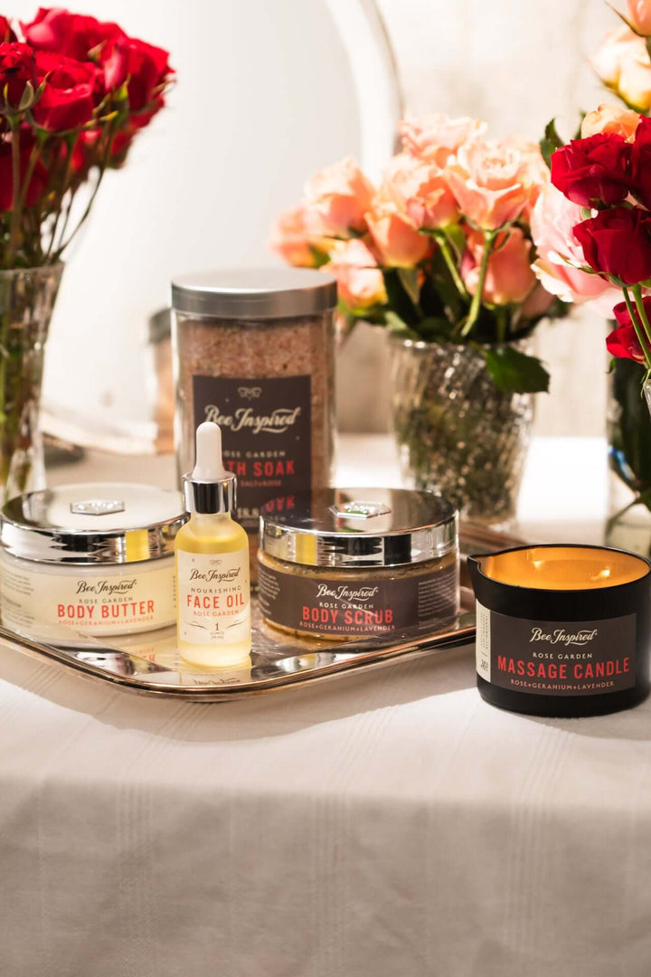 spring awakening experience set from bee inspired honey retail store in owings mills on a table with roses