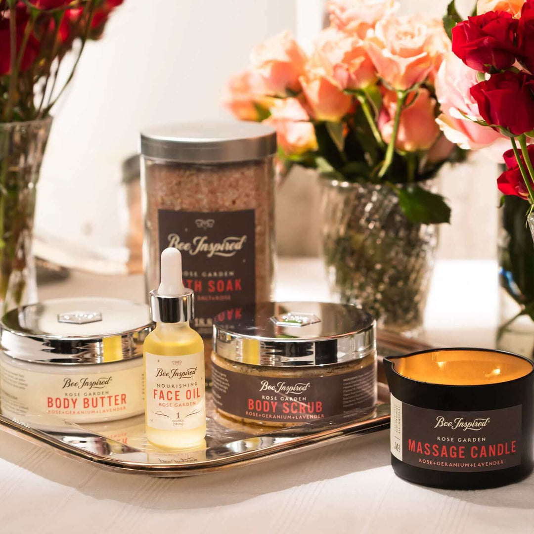Rose Garden gift set by Bee Inspired on display with red and pink roses