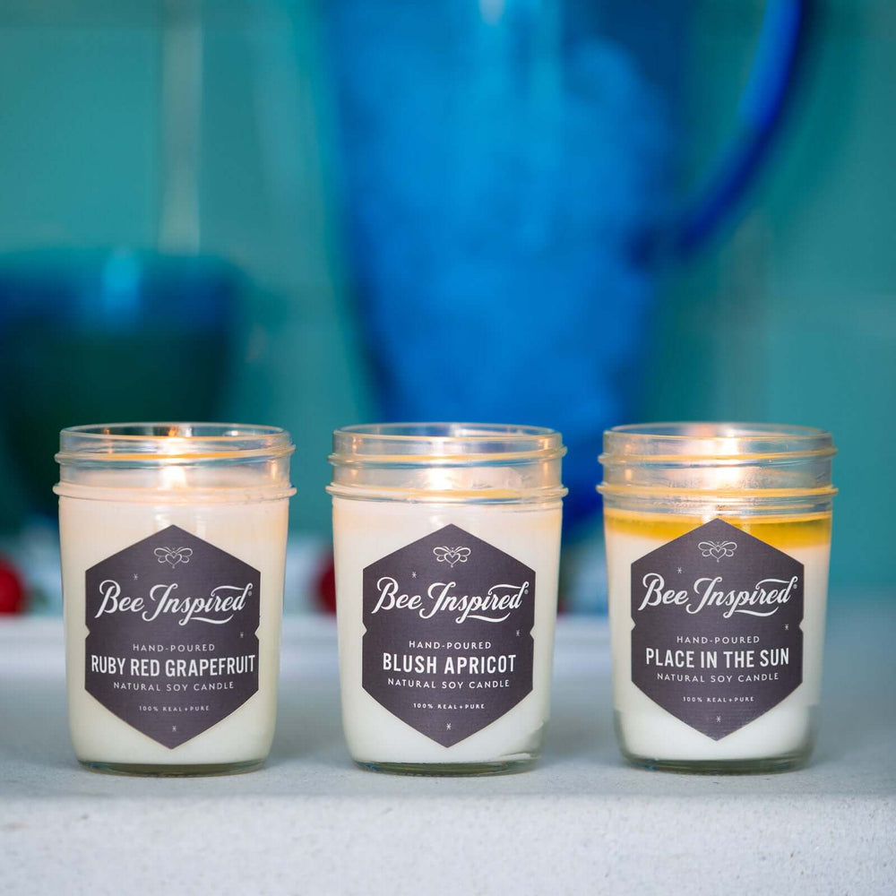 Summer Candle Set burning against blue background