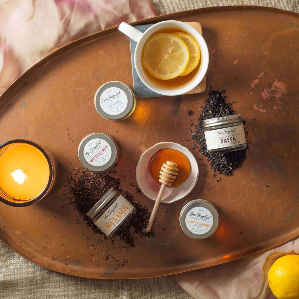 components of tea for two tower with lemons and burning candle