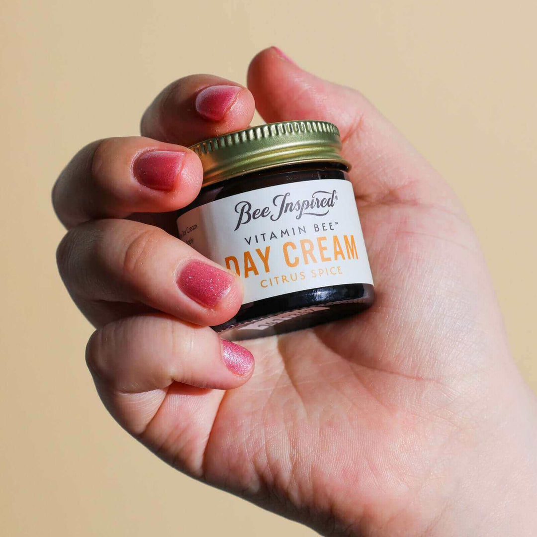 Holding Vitamin Bee citrus spice day cream