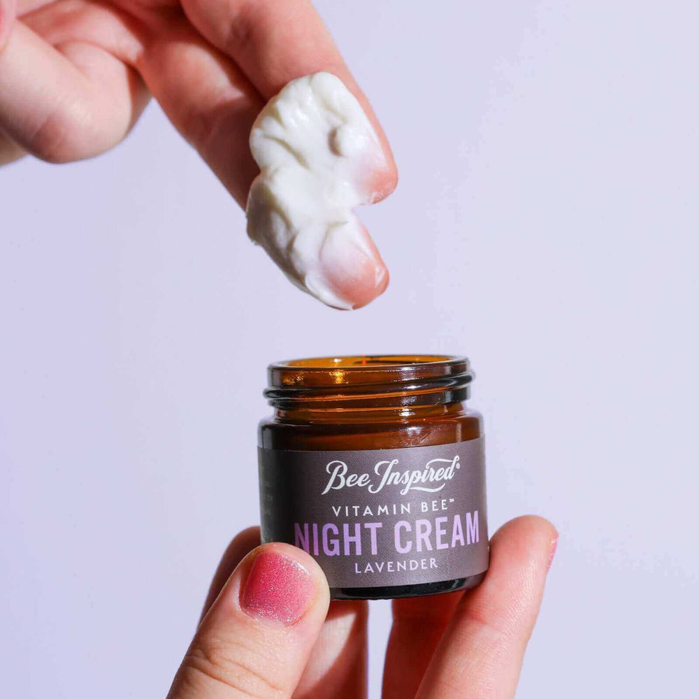 Taking Vitamin Bee lavender night cream out of the jar