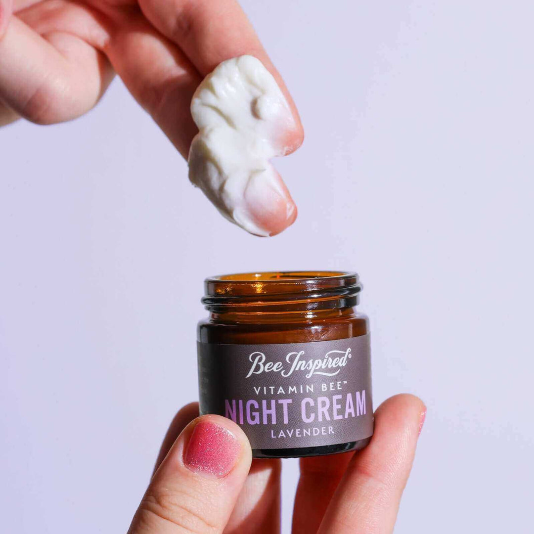 Taking Vitamin Bee lavender night cream out of the jar