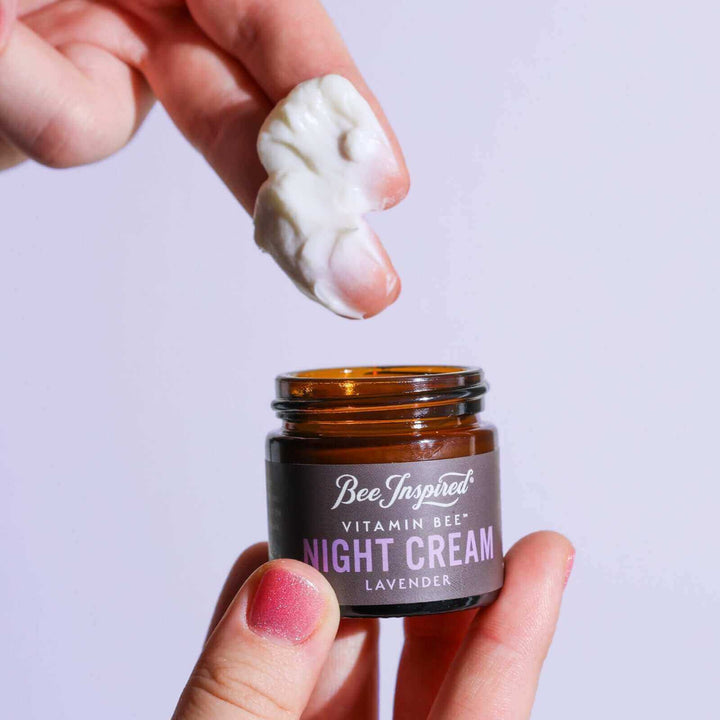 Taking Vitamin Bee lavender night cream out of the jar