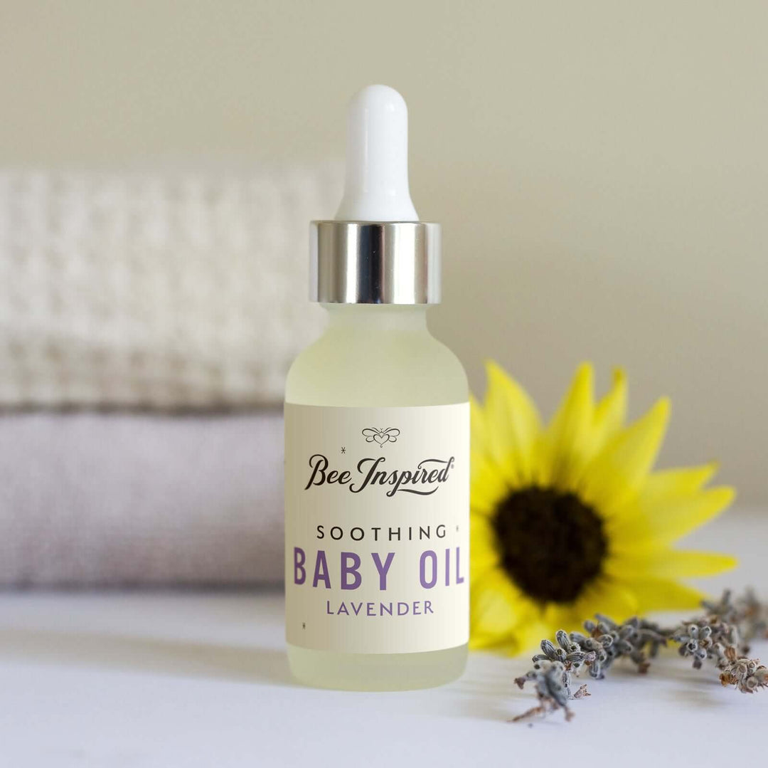lavender baby oil with a yellow flower and lavender
