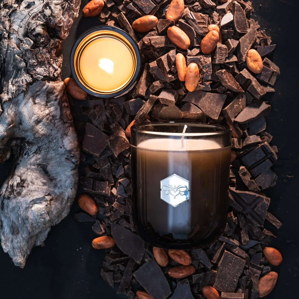 Haute Cocoa luxe candle flat lay with chocolate and almonds