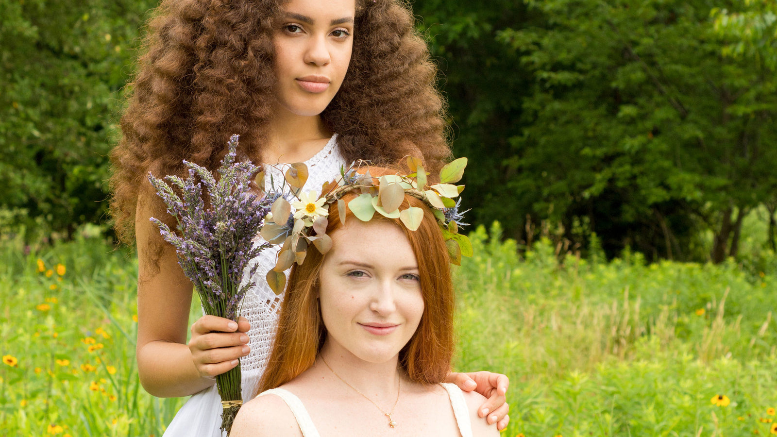 girls in a field with flowers