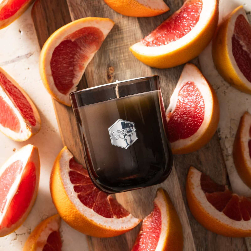 Ruby Red Grapefruit luxe candle flat lay on grapefruit slices