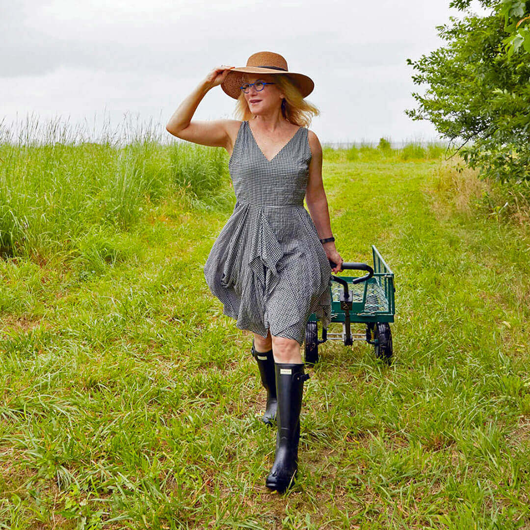 Kara in a field pulling a wagon