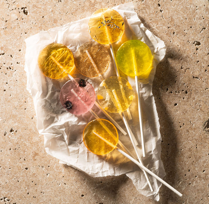 variety of honey lollipops on set