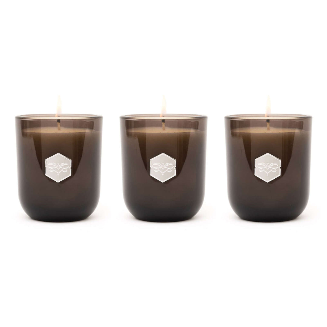 Three luxe candles on white