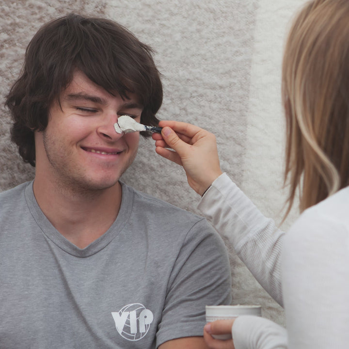 A short stop motion video of a girl applying a face mask to her boyfriend's face
