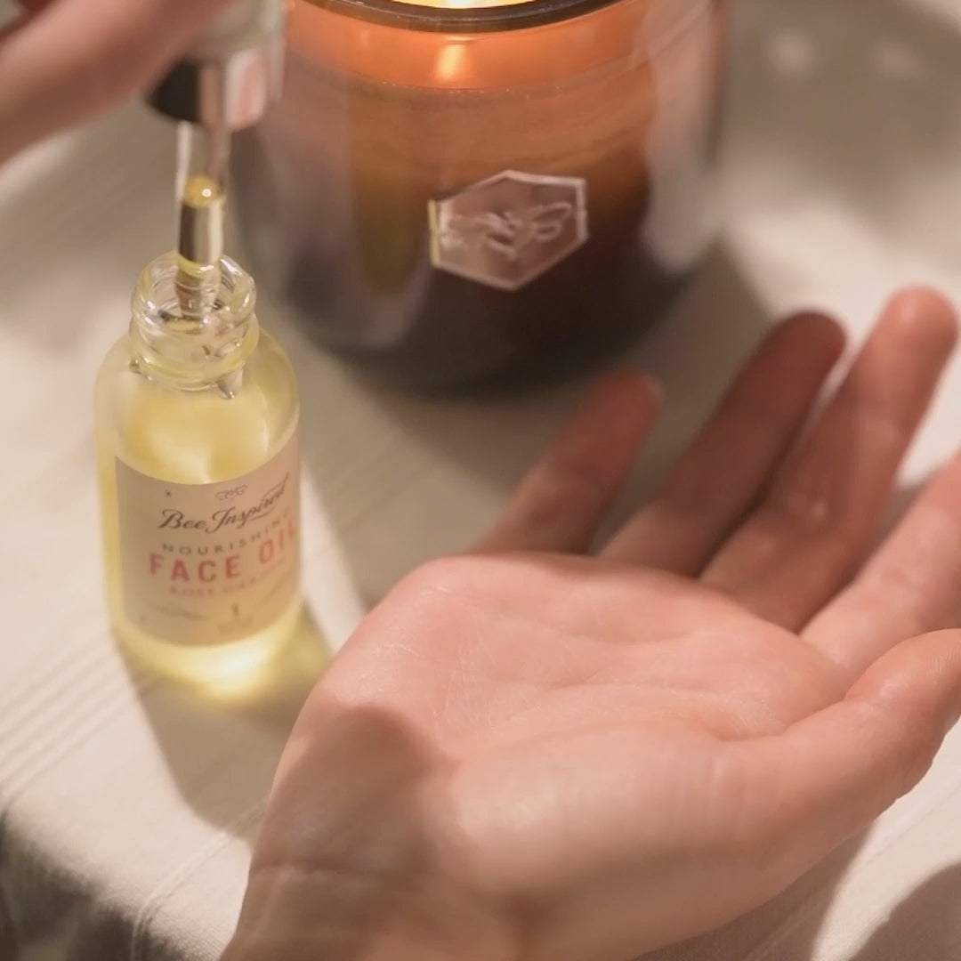 A short video of someone dropping face oil onto their palm