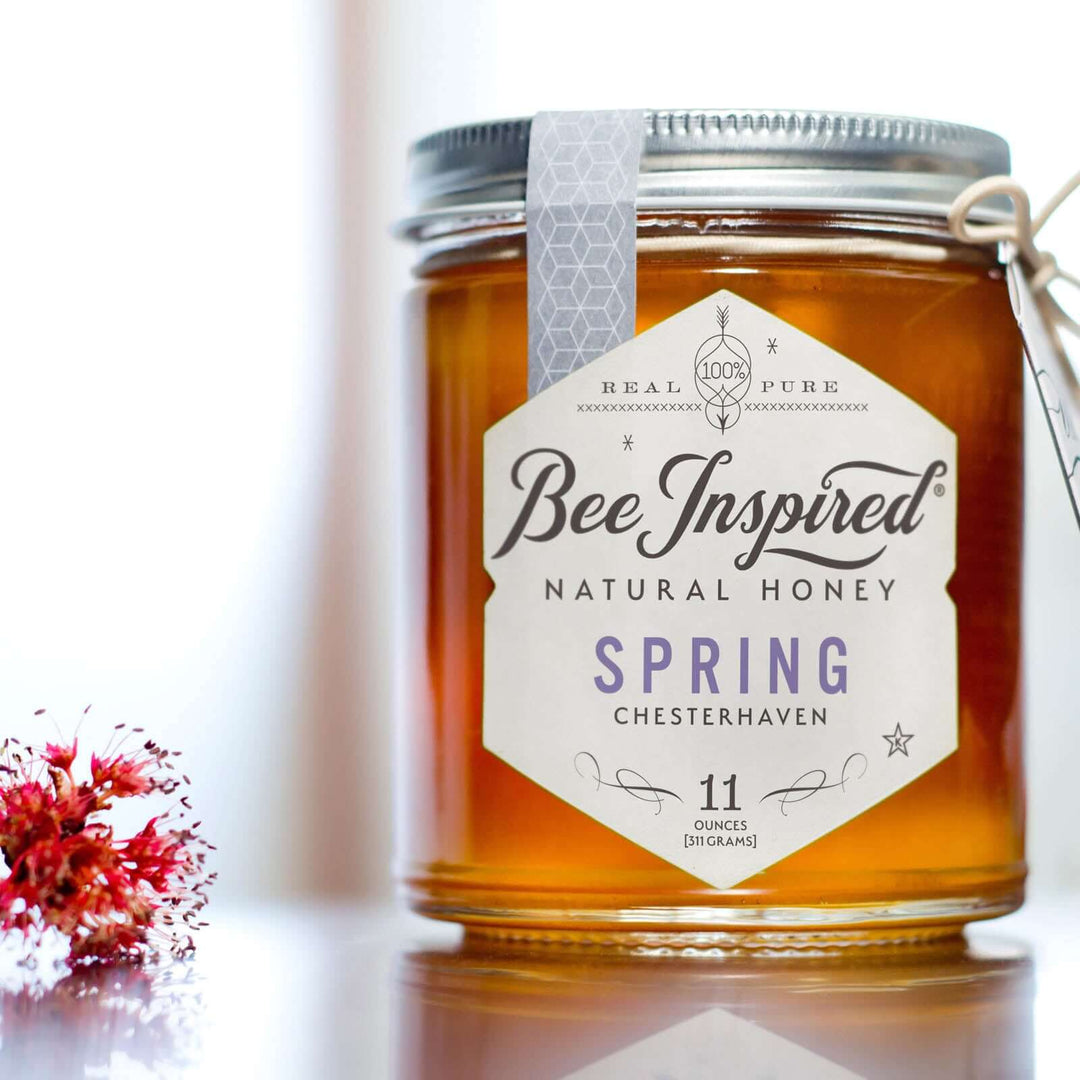 Spring honey next to flowers
