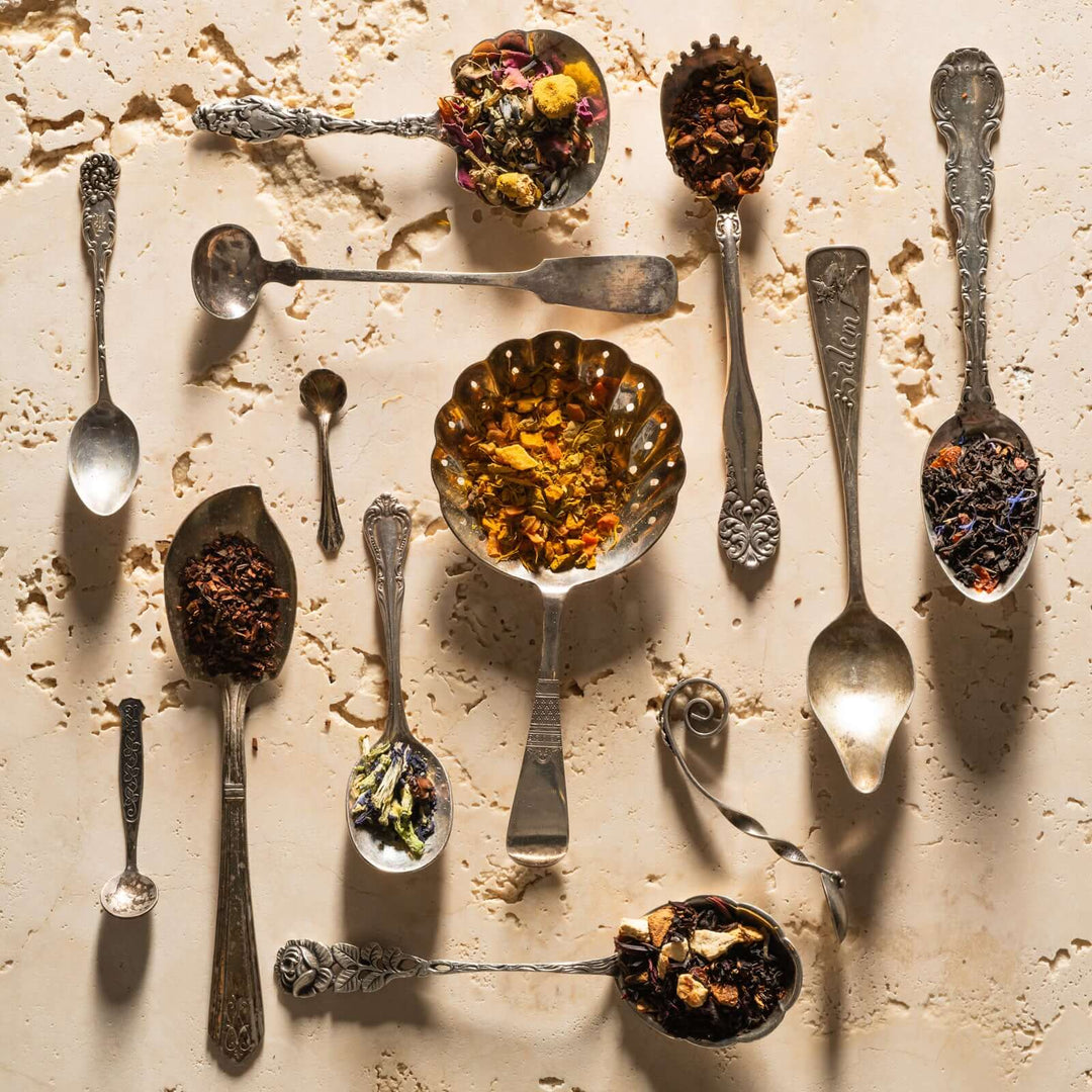 multiple fancy spoons with loose leaf tea