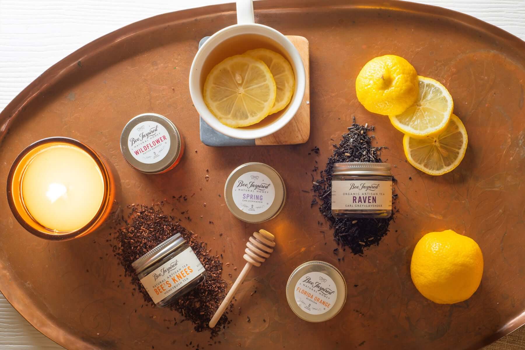 components of tea for two tower with lemons and burning candle