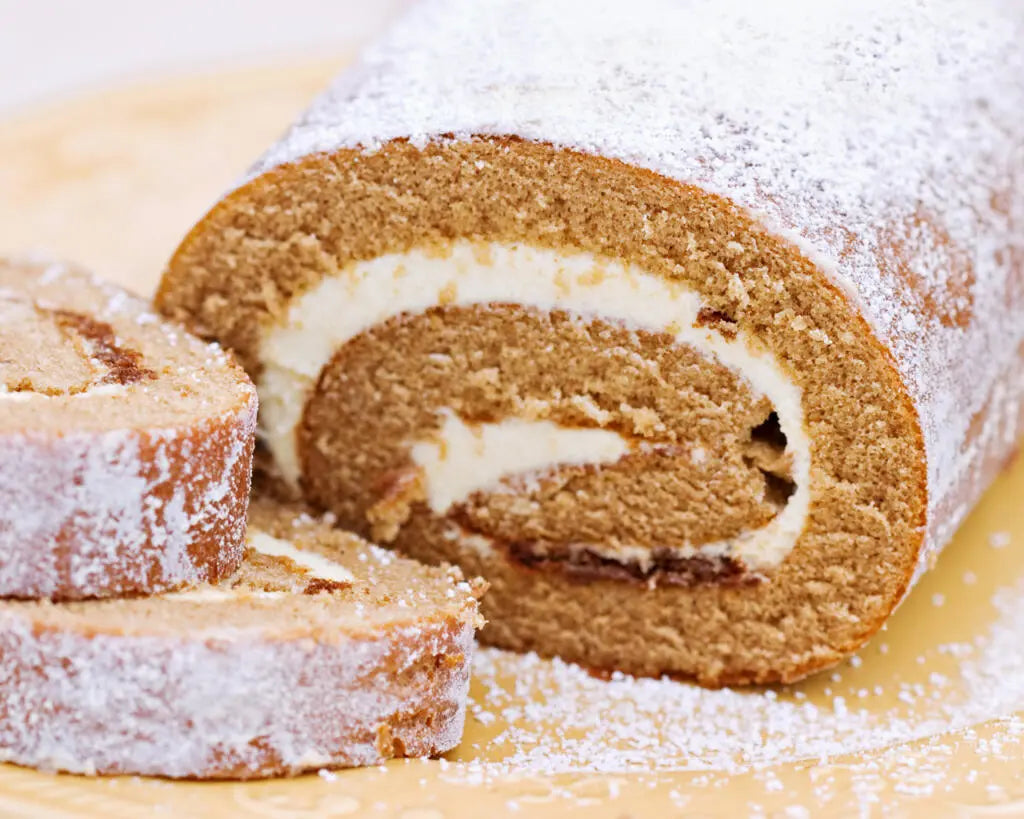 fresh-baked pumpkin roll with cut slices up close