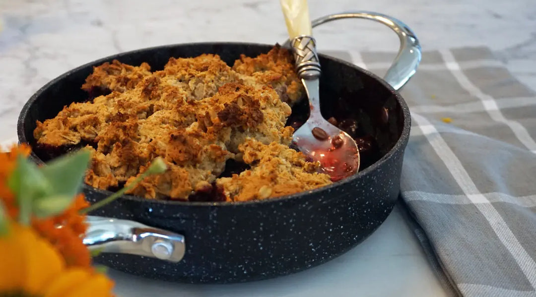 Cherry Cobbler on counter wtih spoon