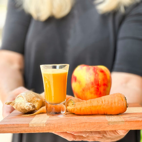 serving a simple ginger shot with lemon