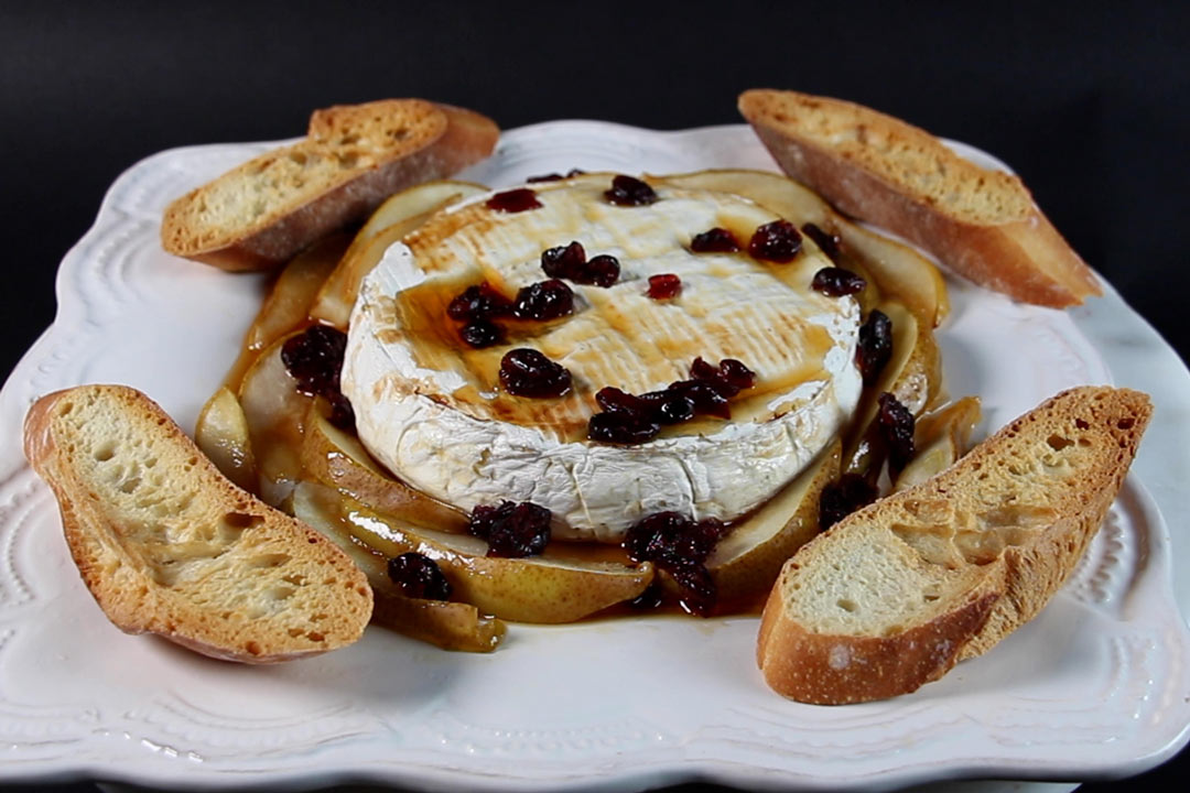 baked brie with honey, pears, dried cranberries, toasted bread