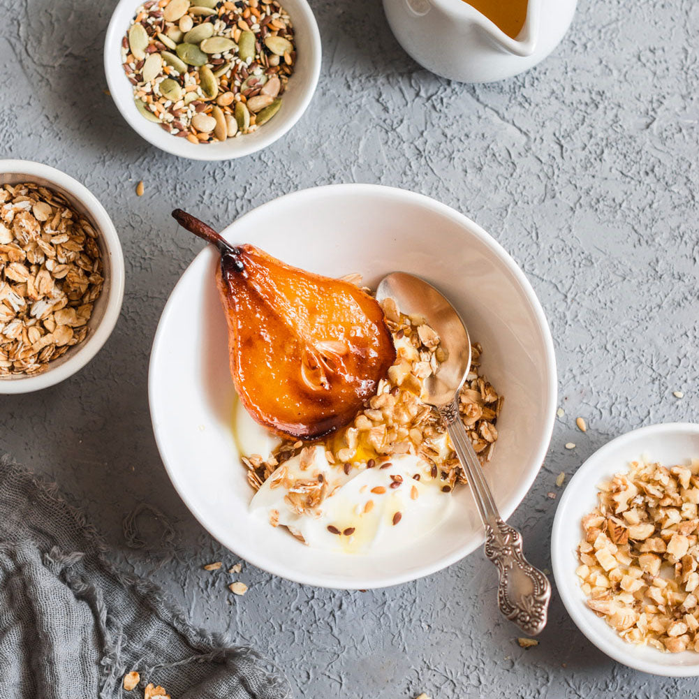 caramelized pears in a bowl with greek yogurt and granola