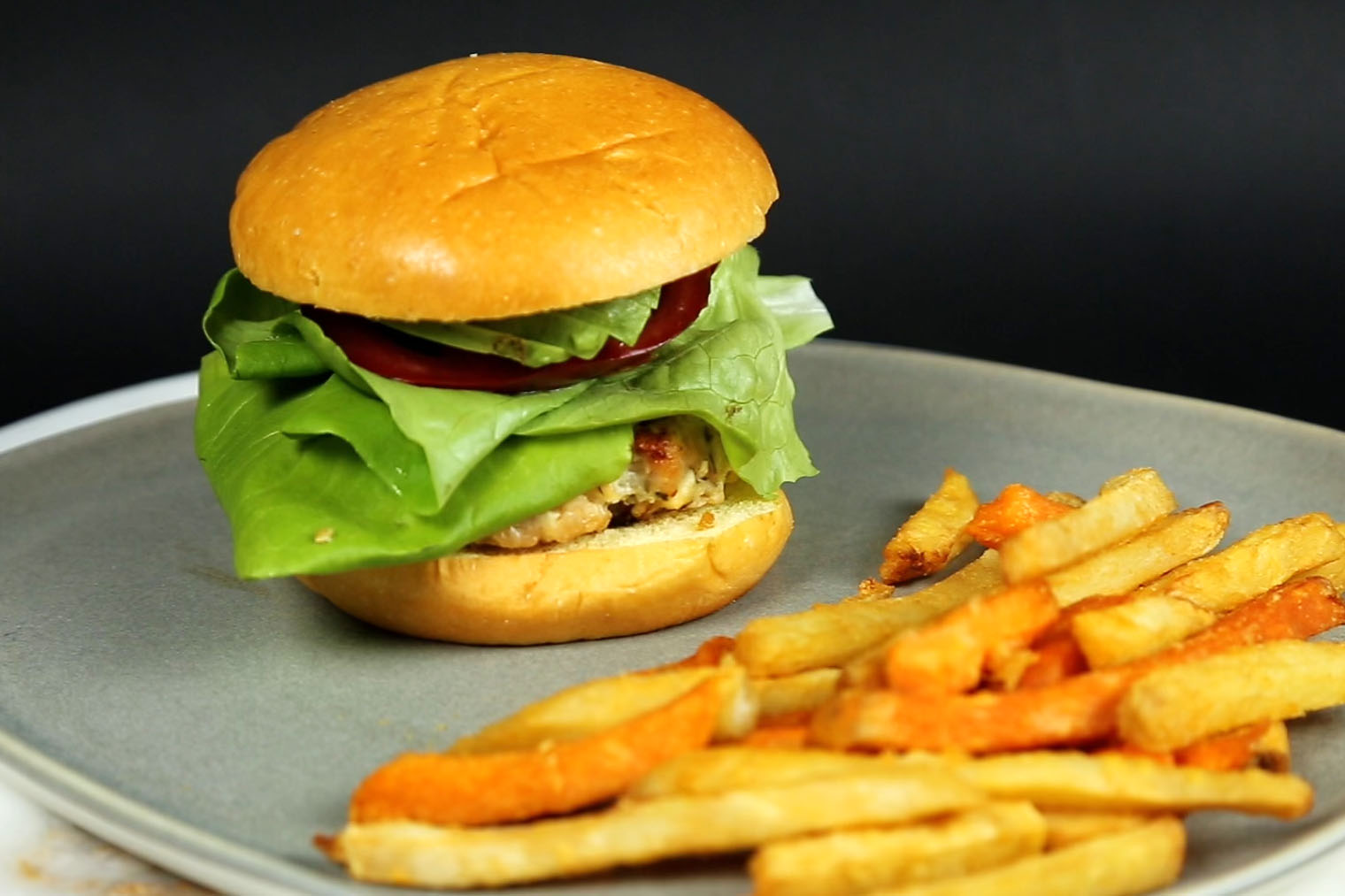 assembled feta turkey burger with honey and sweet potato fries