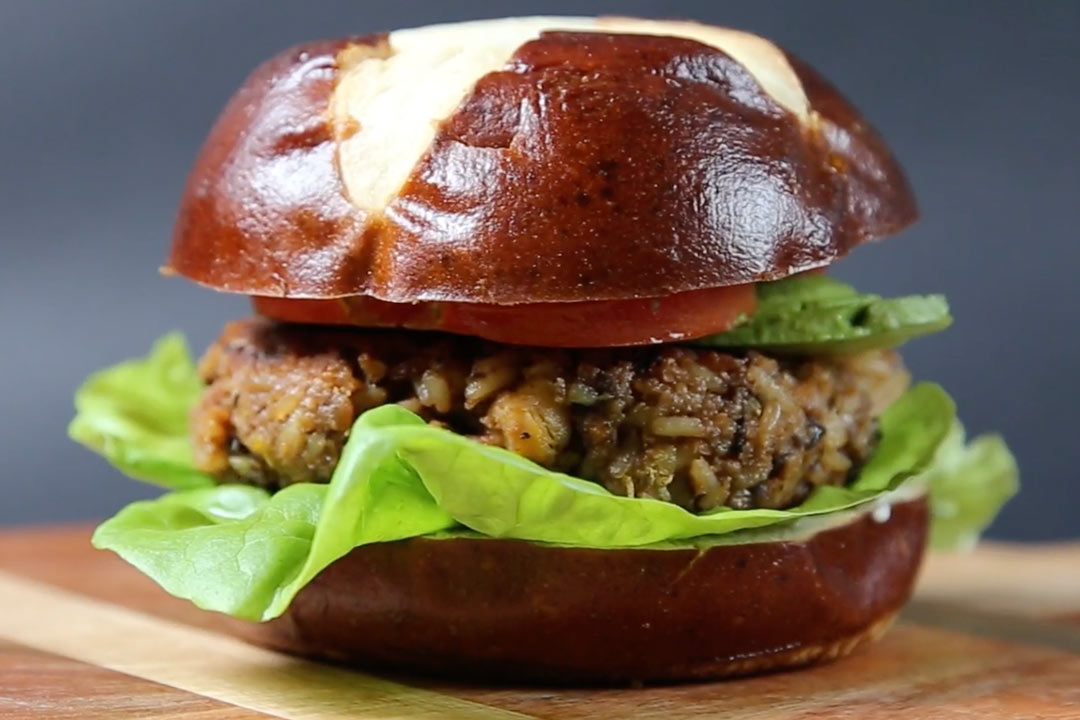 black bean chickpea burger with honey and toppings