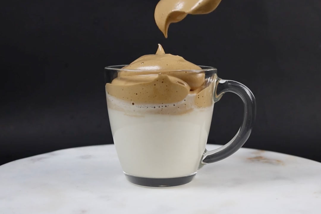 pumpkin spice whipped coffee on top of milk