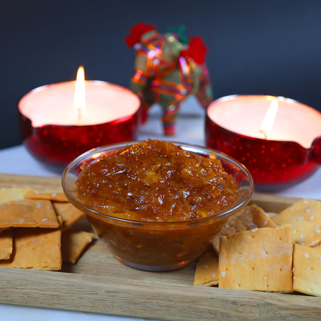 mango chutney on a platter with crackers