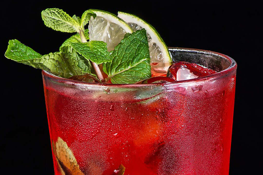close up of mistletoe margarita with green garnish