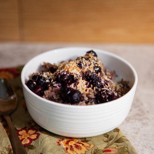 buckwheat cereal topped with blueberries, honey, and toasted coconut