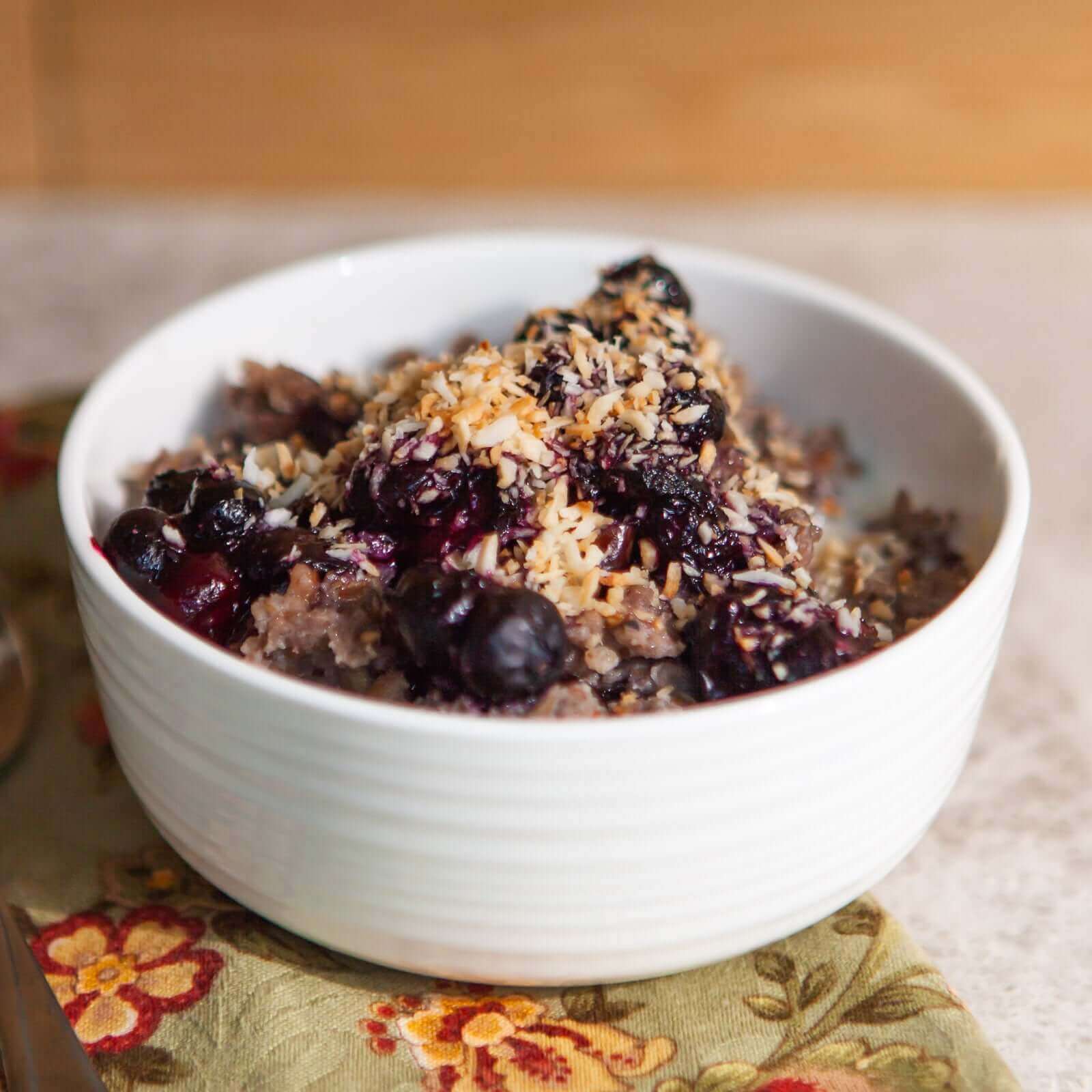 buckwheat cereal topped with blueberries, honey, and toasted coconut